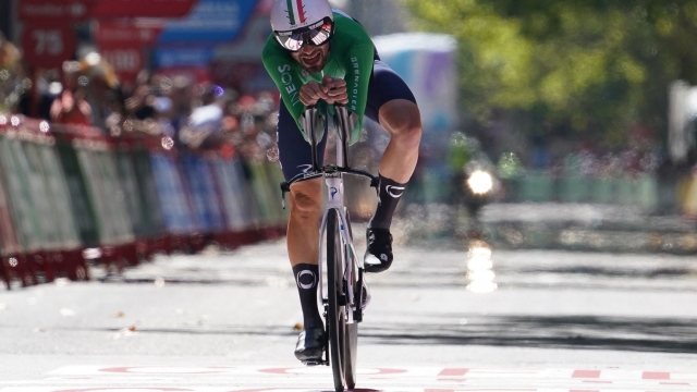 Team Ineos' Italian rider Filippo Ganna crosses the finish line to win the stage 10 of the 2023 La Vuelta cycling tour of Spain, a 25,8 km individual time trial in Valladolid, on September 5, 2023. (Photo by CESAR MANSO / AFP)