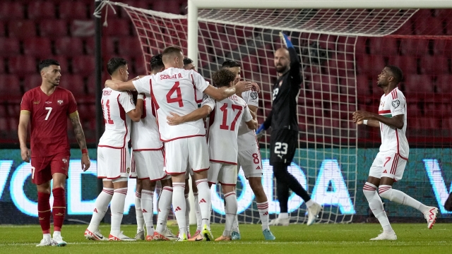 Hungary's players celebrate their side's first goal during the Euro 2024 group G qualifying soccer match between Serbia and Hungary in Belgrade, Serbia, Thursday, Sept. 7, 2023. (AP Photo/Darko Vojinovic)