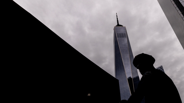 A police officer patrols outside of a ceremony to commemorate the 21st anniversary of the Sept. 11 attacks, Sunday, Sept. 11, 2022, at the National September 11 Memorial & Museum in New York. (AP Photo/Julia Nikhinson)