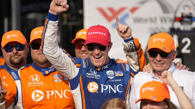 Scott Dixon celebrates after winning an IndyCar auto race at World Wide Technology Raceway, Sunday, Aug. 27, 2023, in Madison, Ill. (AP Photo/Jeff Roberson)