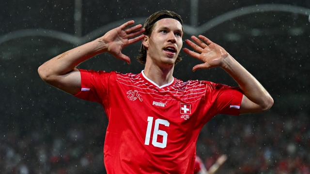 Switzerland's forward #16 Cedric Itten celebrates after he scored the first goal for his team during the UEFA Euro 2024 football tournament Group I qualifying match between Switzerland and Andorra at Tourbillon stadium in Sion on September 12,  2023. (Photo by Fabrice COFFRINI / AFP)