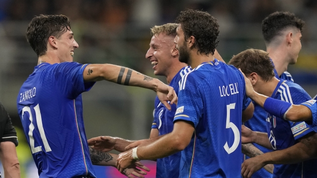 Italy's Davide Frattesi, second from left, celebrates with his teammates after scoring against Ukraine during the Euro 2024 group C qualifying soccer match between Italy and Ukraine at San Siro Stadium, in Milan, Italy, Tuesday, Sept.12, 2023. (AP Photo/Antonio Calanni)