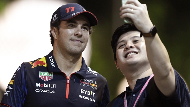 SINGAPORE, SINGAPORE - SEPTEMBER 14: Sergio Perez of Mexico and Oracle Red Bull Racing poses for a photo in the Paddock during previews ahead of the F1 Grand Prix of Singapore at Marina Bay Street Circuit on September 14, 2023 in Singapore, Singapore. (Photo by Rudy Carezzevoli/Getty Images)