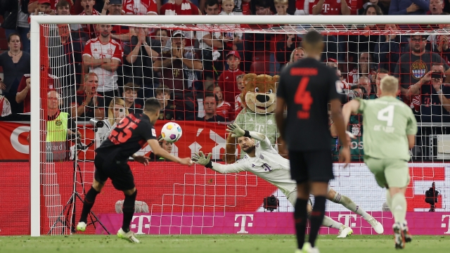 MUNICH, GERMANY - SEPTEMBER 15: Exequiel Palacios of Bayer Leverkusen scores the team's second goal from the penalty spot to equalise during the Bundesliga match between FC Bayern München and Bayer 04 Leverkusen at Allianz Arena on September 15, 2023 in Munich, Germany. (Photo by Lars Baron/Getty Images)