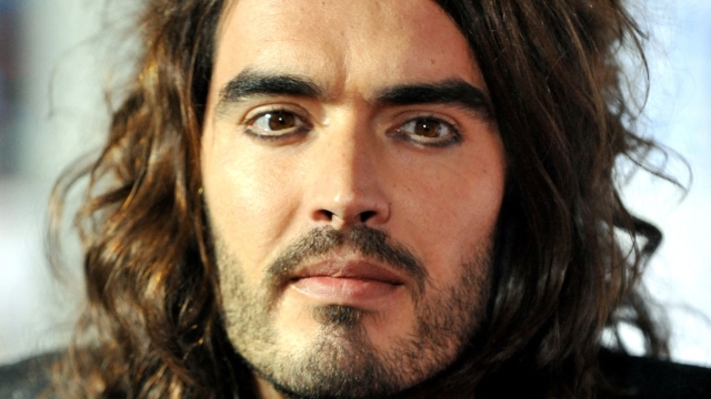 (FILES) Cast member Russell Brand arrives for the world premiere of "Bedtime Stories" in Hollywood, California, on December 18, 2008. British comedian and actor Russell Brand has been accused of rape, sexual assaults and emotional abuse during a seven-year period, according to the results of a media investigation published on September 16, 2023. (Photo by Jewel SAMAD / AFP)