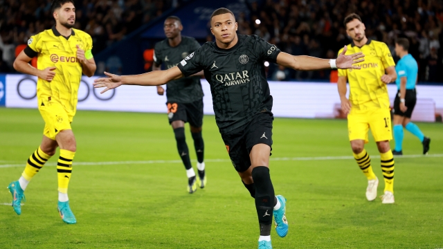 PARIS, FRANCE - SEPTEMBER 19: Kylian Mbappe of Paris Saint-Germain celebrates after scoring the team's first goal from the penalty spot during the UEFA Champions League Group F match between Paris Saint-Germain and Borussia Dortmund at Parc des Princes on September 19, 2023 in Paris, France. (Photo by Johannes Simon/Getty Images)