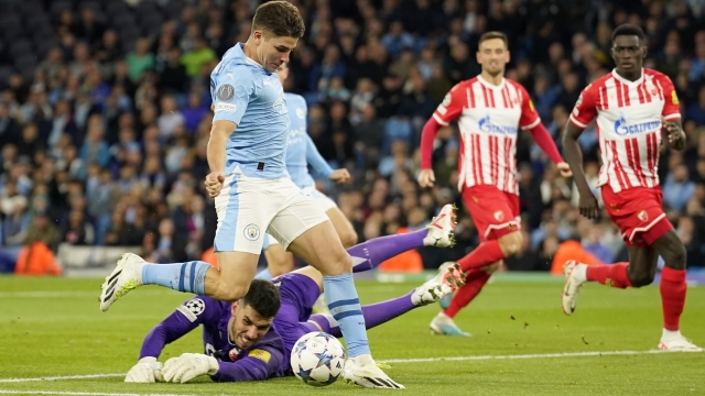 Manchester City's Julian Alvarez gets past Red Star's goalkeeper Omri Glazer to score his side's first goal during the Champions League group G soccer match between Manchester City and Red Star Belgrade in Manchester, England, Tuesday Sept. 19, 2023. (AP Photo/Dave Thompson)