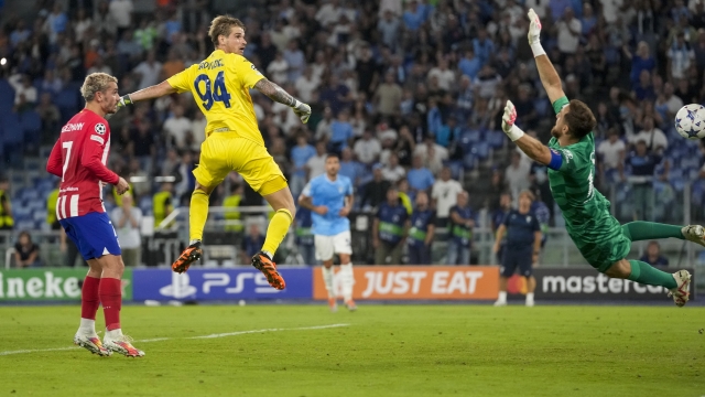 Lazio's goalkeeper Ivan Provedel, center, scores his side's opening goal during a Champions League group E soccer match between Lazio and Atletico Madrid, at Rome's Olympic Stadium, Tuesday, Sept. 19, 2023. (AP Photo/Andrew Medichini)