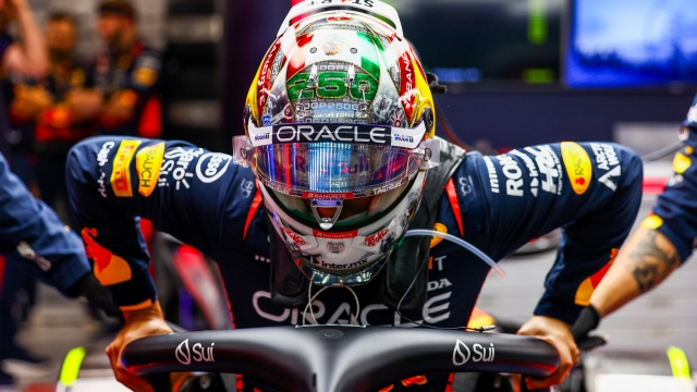 SINGAPORE, SINGAPORE - SEPTEMBER 17: Sergio Perez of Mexico and Oracle Red Bull Racing prepares to drive in the garage prior to the F1 Grand Prix of Singapore at Marina Bay Street Circuit on September 17, 2023 in Singapore, Singapore. (Photo by Mark Thompson/Getty Images)