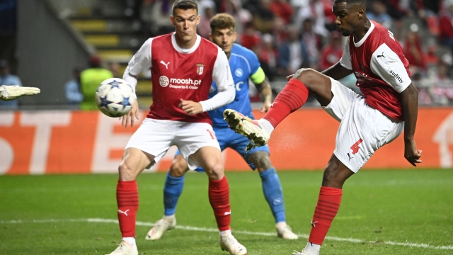 Sporting Braga's Malian defender #04 Sikou Niakate (R) kicks and scores an own-goal during the UEFA Champions League 1st round day 1 group C football match between SC Braga and Napoli at the Municipal stadium of Braga on September 20, 2023. (Photo by MIGUEL RIOPA / AFP)