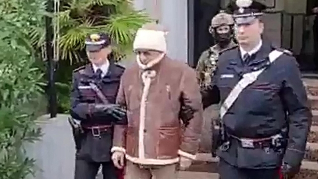 A handout photo made available by Italy's Carabinieri shows a video frame of the Mafia boss Matteo Messina Denaro (C), Italy's most wanted man, being arrested in Palermo, Sicily, by the Carabinieri police's ROS unit after 30 years on the run  in Palermo, Sicily island, Italy, 16 January 2023. ANSA/US CARABINIERI +++ NO SALES, EDITORIAL USE ONLY +++ NPK +++