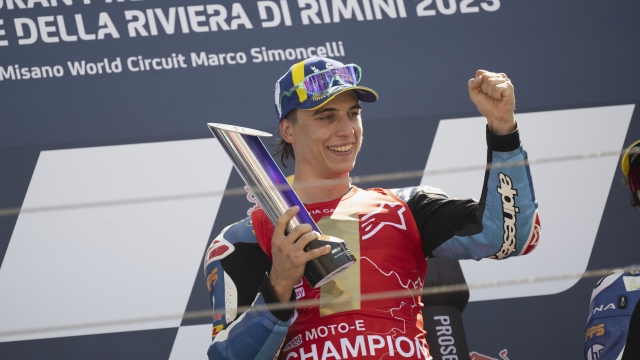 MISANO ADRIATICO, ITALY - SEPTEMBER 09: Mattia Casadei of Italy and HP Pons Los40  celebrates on the podium the victory of the 2023 MotoE World Championship  during the MotoGP Of San Marino - Qualifying at Misano World Circuit on September 09, 2023 in Misano Adriatico, Italy. (Photo by Mirco Lazzari gp/Getty Images)