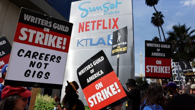 LOS ANGELES, CALIFORNIA - SEPTEMBER 22: Striking WGA (Writers Guild of America) members picket with striking SAG-AFTRA members outside Netflix studios on September 22, 2023 in Los Angeles, California. The Writers Guild of America and Alliance of Motion Picture and Television Producers (AMPTP) are reportedly meeting for a third straight day today in a new round of contract talks in the nearly five-months long writers strike.   Mario Tama/Getty Images/AFP (Photo by MARIO TAMA / GETTY IMAGES NORTH AMERICA / Getty Images via AFP)