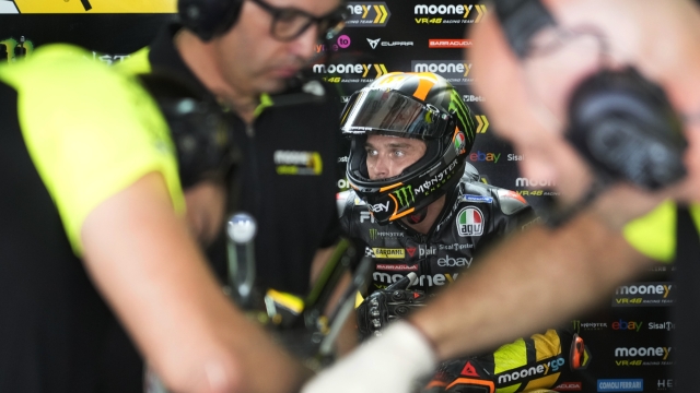 Mooney VR46 Racing Team (Ducati) team member Luca Marini take a quick break at Pit lane during MotoGP practice session at the Buddh International Circuit in Greater Noida, on the outskirts of New Delhi, India Friday, Sept. 22, 2023. (AP Photo/Manish Swarup)