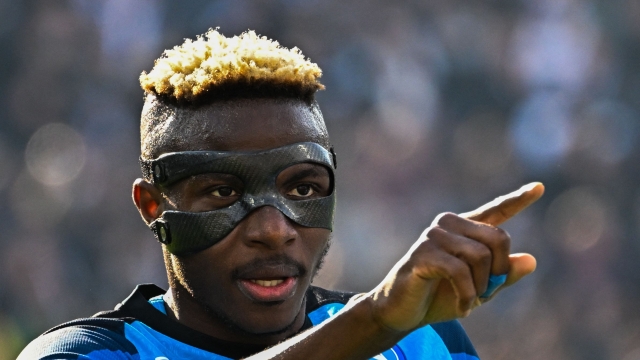 Napoli's Nigerian forward Victor Osimhen celebrates after scoring during the Italian Serie A football match between Spezia and Napoli on February 5, 2023 at the Alberto-Picco stadium in La Spezia. (Photo by Alberto PIZZOLI / AFP)
