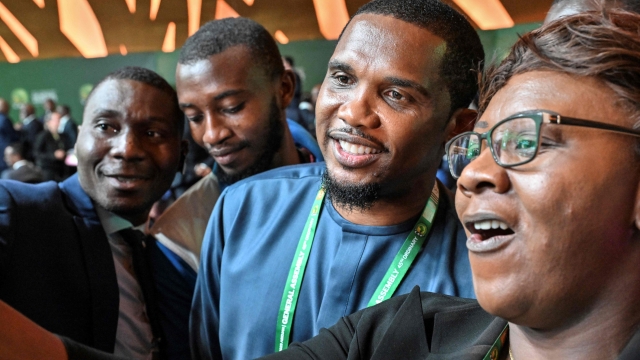 Cameroon's Football Federation president Samuel Eto'o (C) takes pictures with attendees as he attends the African Confederation of Football (CAF) 45th Ordinary General Assembly in Abidjan in Ivory Coast on July 13, 2023. (Photo by Issouf SANOGO / AFP)