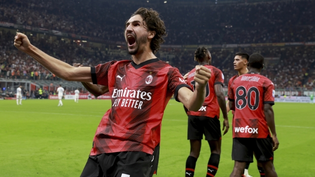 MILAN, ITALY - SEPTEMBER 30: Yacine Adli of AC Milan celebrates after his team-mate Christian Pulisic scored during the Serie A TIM match between AC Milan and SS Lazio at Stadio Giuseppe Meazza on September 30, 2023 in Milan, Italy. (Photo by Giuseppe Cottini/AC Milan via Getty Images)