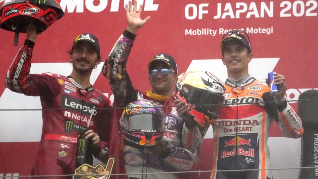 Winner Spain's Jorge Martin, center, second placed Italy's Francesco Bagnaia, left, and third placed Spanish rider Marc Marquez celebrate on the podium after the MotoGP race of Japanese Motorcycle Grand Prix at the Twin Ring Motegi circuit in Motegi, north of Tokyo Sunday, Oct. 1, 2023.(AP Photo/Shuji Kajiyama)