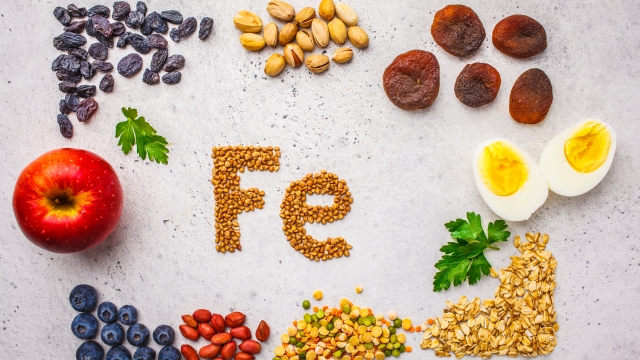 Healthy product sources of Fe. Top view, food background, iron ingredients: buckwheat, dried fruit, apple, eggs on a white background.