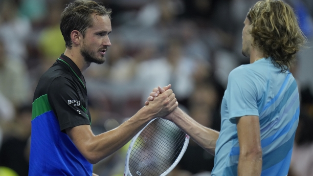 Daniil Medvedev of Russia, left, shakes hands with Alexander Zverev of Germany after beating him in the men's singles semifinal match of the China Open tennis tournament at the Diamond Court in Beijing, Tuesday, Oct. 3, 2023. (AP Photo/Andy Wong)