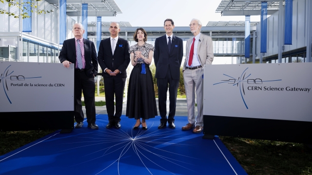 epa10905217 Director General of the European Organization for Nuclear Research (CERN) Fabiola Gianotti (C) speaks to the media next to (L-R) President of the CERN Council Eliezer Rabinovici, Swiss President Alain Berset, Stellantis Chairman John Elkann, and Italian architect Renzo Piano during the inauguration ceremony of the new center for education and outreach 'Science Gateway' at the European Organization for Nuclear Research (CERN) headquarters, in Meyrin, near Geneva, Switzerland, 07 October 2023. The CERN Science Gateway will be open to the public from 08 October.  EPA/SALVATORE DI NOLFI