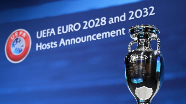 A photograph taken on October 10, 2023, shows the UEFA Euro trophy on display a few moments before the announcement of the elected countries which will host the Euro 2028 and the Euro 2032 fooball tournaments during a ceremony at the UEFA headquarters in Nyon. Seven years after awarding Euro-2024 to Germany, UEFA announced on October 10, 2023 the hosts for the next two editions: The United Kingdom and Ireland are due to host the tournament together in 2028, followed by the unprecedented tandem of Italy and Turkey in 2032. (Photo by Fabrice COFFRINI / AFP)