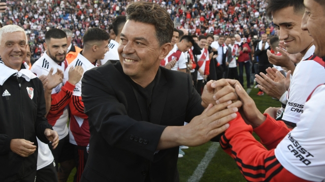 River Plate players greet their coach, Argentine Marcelo Gallardo, after the end of his final match as River Plate's coach against Spain's Real Betis at the Malvinas Argentinas stadium in Mendoza, Argentina, on November 13, 2022. (Photo by Andres Larrovere / AFP)