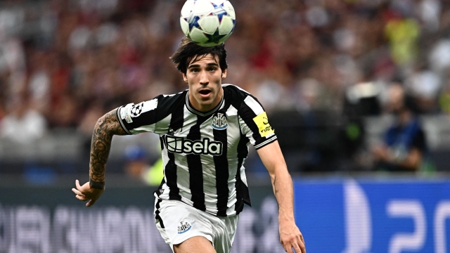 Newcastle United's Italian midfielder #08 Sandro Tonali eyes the ball during the UEFA Champions League 1st round group F football match between AC Milan and Newcastle at the San Siro stadium in Milan on September 19, 2023. (Photo by GABRIEL BOUYS / AFP)