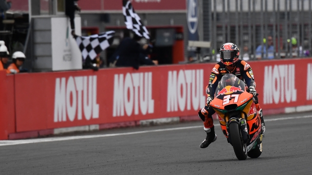 Third place Red Bull KTM Ajo rider Pedro Acosta of Spain receives the checkered flag during the Moto2 class race of MotoGP Japanese Grand Prix at the Mobility Resort Motegi in Motegi, Tochigi prefecture on October 1, 2023. (Photo by Toshifumi KITAMURA / AFP)