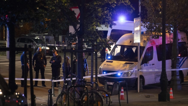 This photograph shows the police perimeter at the site of a shooting incident in the Ieperlaan - Boulevard d'Ypres, in Brussels, on October 16, 2023. Two people were killed during a shooting in Brussels on October 16, 2023 evening and the suspect was on the run, the Belgian capital's prosecutor's office said. (Photo by HATIM KAGHAT / Belga / AFP) / Belgium OUT