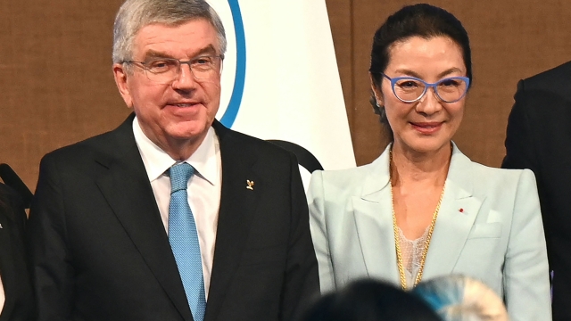 Newly elected International Olympic Committee (IOC) member Malaysian actress Michelle Yeoh (R) poses next to IOC President Thomas Bach during the third day of the 141st IOC session in Mumbai on October 17, 2023. Yeoh was voted onto the International Olympic Committee on October 17. The first Asian woman to win an Academy Award -- when she scooped best actress for "Everything Everywhere All at Once" earlier this year -- was elected by 67 votes to nine, with one abstention. (Photo by INDRANIL MUKHERJEE / AFP)