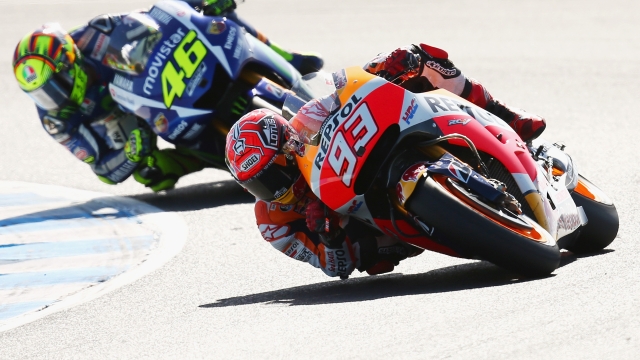 PHILLIP ISLAND, AUSTRALIA - OCTOBER 18:  Marc Marquez of Spain and the Repsol Honda Team leads Valentino Rossi of Italy and Movistar Yamaha MotoGP during the 2015 MotoGP of Australia at Phillip Island Grand Prix Circuit on October 18, 2015 in Phillip Island, Australia.  (Photo by Cameron Spencer/Getty Images)