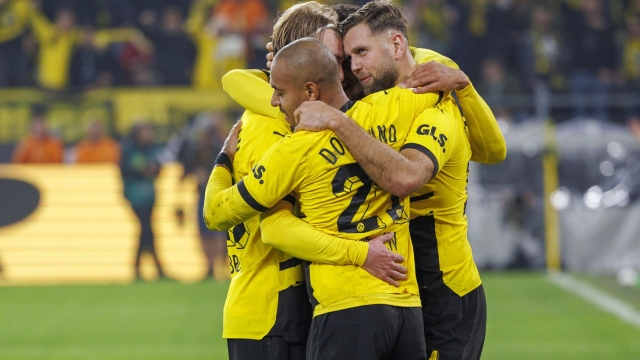 epa10929713 Dortmund's Julian Brandt (L) celebrates with teammates  after scoring the 1-0 lead during the German Bundesliga soccer match between Borussia Dortmund and SV Werder Bremen in Dortmund, Germany, 20 October 2023.  EPA/CHRISTOPHER NEUNDORF CONDITIONS - ATTENTION: The DFL regulations prohibit any use of photographs as image sequences and/or quasi-video.