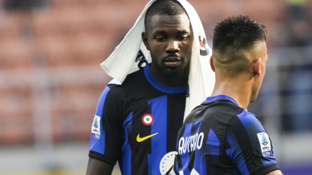 Inter Milan's Inter Milan's Lautaro Martinez and Marcus Thuram react at the end of a Serie A soccer match between Inter Milan and Bologna at the San Siro stadium in Milan, Italy, Saturday, Oct.7, 2023. (AP Photo/Luca Bruno)