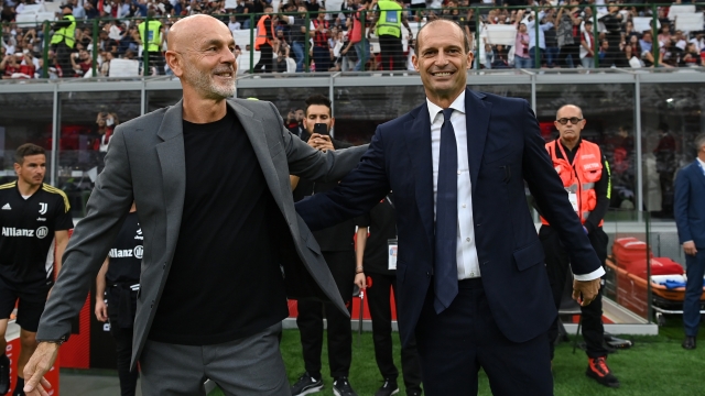 MILAN, ITALY - OCTOBER 08: Head coach of AC Milan Stefano Pioli greets head coach oh Juventus Massimiliano Allegri before the Serie A match between AC Milan and Juventus at Stadio Giuseppe Meazza on October 08, 2022 in Milan, Italy. (Photo by Claudio Villa/AC Milan via Getty Images)