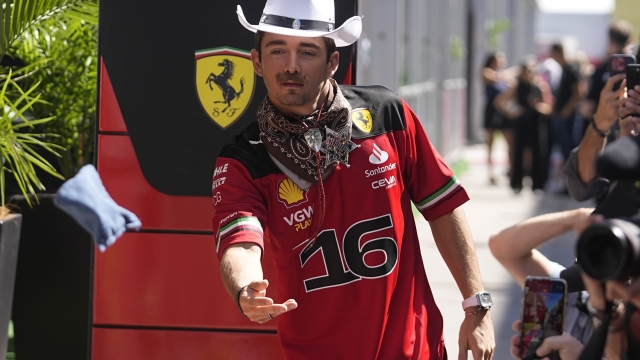 Ferrari driver Charles Leclerc, of Monaco, plays corn hole in the paddock at the Formula One U.S. Grand Prix auto race at Circuit of the Americas, Thursday, Oct. 19, 2023, in Austin, Texas. (AP Photo/Darron Cummings)