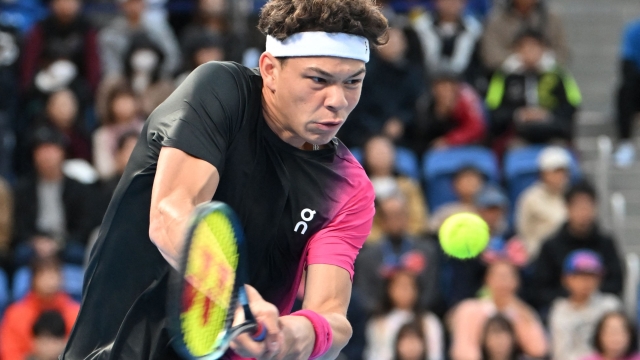 USA's Ben Shelton hits a return against Russias Aslan Karatsev during their men's singles final match at the ATP Japan Open tennis tournament in Tokyo on October 22, 2023. (Photo by Kazuhiro NOGI / AFP)