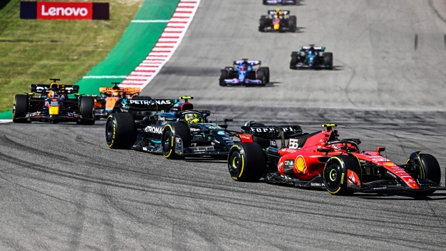 Ferrari's Spanish driver Carlos Sainz Jr followed by Mercedes' British driver Lewis Hamilton and Red Bull Racing's Dutch driver Max Verstappen start the 2023 United States Formula One Grand Prix at the Circuit of the Americas in Austin, Texas, on October 22, 2023. (Photo by CHANDAN KHANNA / AFP)