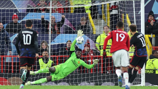 MANCHESTER, ENGLAND - OCTOBER 24: Andre Onana of Manchester United saves a penalty by Jordan Larsson of FC Copenhagen during the UEFA Champions League match between Manchester United and F.C. Copenhagen at Old Trafford on October 24, 2023 in Manchester, England. (Photo by Jan Kruger/Getty Images)