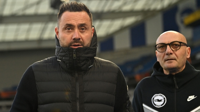 Brighton's Italian head coach Roberto De Zerbi (L) arrives ahead of the UEFA Europa League Group B football match between Brighton and Hove Albion and Ajax at the American Express Community Stadium in Brighton, southern England on October 26, 2023. (Photo by Glyn KIRK / AFP)