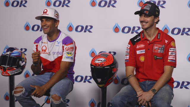 BURIRAM, THAILAND - OCTOBER 26: (L-R) Jorge Martin of Spain and Pramac Racing and Francesco Bagnaia of Italy and Ducati Lenovo Team smile during the press conference pre-event during the MotoGP of Thailand - Previews at Chang International Circuit on October 26, 2023 in Buriram, Thailand. (Photo by Mirco Lazzari gp/Getty Images)
