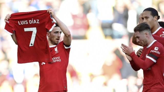 epa10947501 Diogo Jota (L) of Liverpool celebrates after scoring the 1-0 lead holding the jersey of teammate Luis Diaz during the English Premier League match between Liverpool and Nottingham Forest in Liverpool, Britain, 29 October 2023.  EPA/PETER POWELL No use with unauthorized audio, video, data, fixture lists, club/league logos, 'live' services' or as NFTs. Online in-match use limited to 120 images, no video emulation. No use in betting, games or single club/league/player publications.