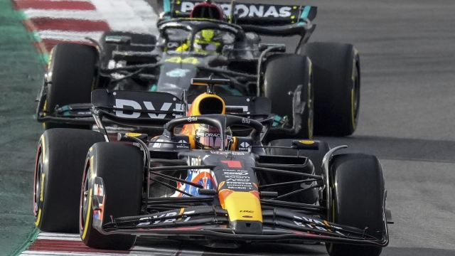 Red Bull driver Max Verstappen, of the Netherlands, is chased closely by Mercedes driver Lewis Hamilton, of Britain, during the sprint ahead of the Formula One U.S. Grand Prix auto race at Circuit of the Americas, Saturday, Oct. 21, 2023, in Austin, Texas. (AP Photo/Nick Didlick)