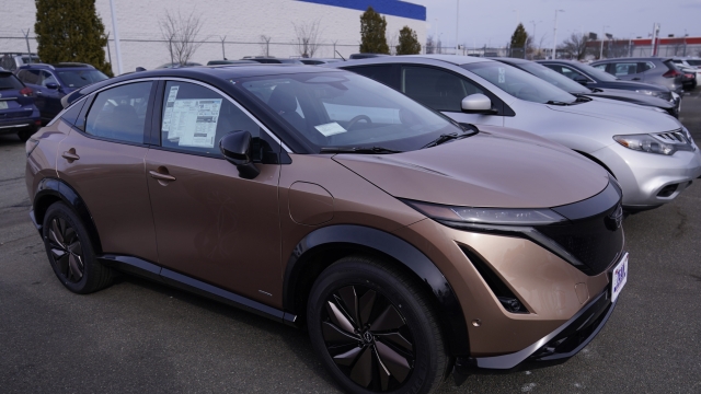 A Nissan ARIYA electric vehicle is parked on a car dealer's lot, Monday, Feb. 6, 2023, in Manchester, N.H. On Friday, the Commerce Department releases U.S. retail sales data for March. In February, retail sales slipped 0.4% after jumping a revised 3.2% in January.(AP Photo/Charles Krupa)
