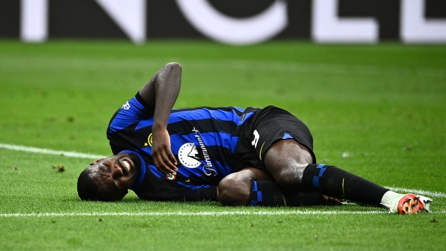 Inter Milan's French forward #09 Marcus Thuram lies on the football pitch after being injured during the Italian Serie A football match between Inter Milan and Fiorentina at San Siro stadium in Milan on September 3, 2023. (Photo by Isabella BONOTTO / AFP)