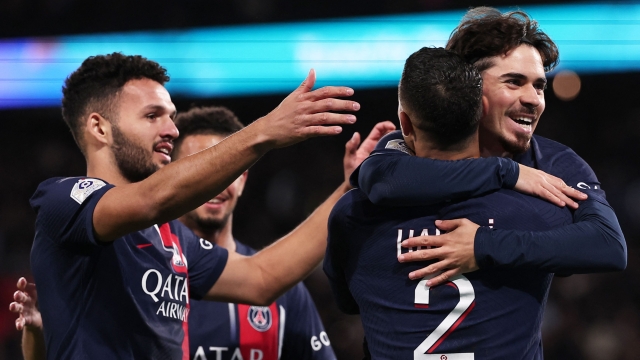 TOPSHOT - Paris Saint-Germain's Portuguese midfielder #17 Vitinha (R) celebrates scoring his team's third goal with teammates during the French L1 football match between Paris Saint-Germain (PSG) and Montpellier Herault SC at The Parc des Princes Stadium in Paris on November 3, 2023. (Photo by FRANCK FIFE / AFP)