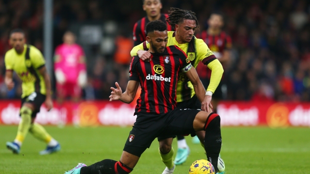 BOURNEMOUTH, ENGLAND - OCTOBER 28: Lloyd Kelly of AFC Bournemouth is challenged by Luca Koleosho of Burnley during the Premier League match between AFC Bournemouth and Burnley FC at Vitality Stadium on October 28, 2023 in Bournemouth, England. (Photo by Charlie Crowhurst/Getty Images)