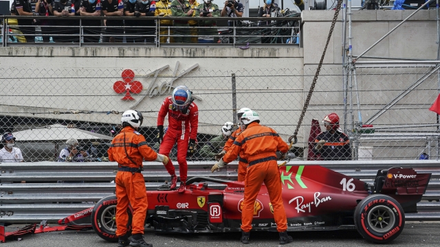 Ferrari driver Charles Leclerc of Monaco gets out of his car on the track after a crash during the qualifying session at the Monaco racetrack, in Monaco, Saturday, May 22, 2021. The Formula One race will take place on Sunday with Ferrari driver Charles Leclerc of Monaco in pole position. (AP Photo/Roberto Piccinini)