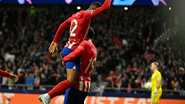 Atletico Madrid's Spanish forward #19 Alvaro Morata celebrates scoring his team's fifth goal, with Atletico Madrid's Brazilian forward #12 Samuel Lino, during the UEFA Champions League group E football match between Club Atletico de Madrid and Celtic at the Metropolitano stadium in Madrid on November 7, 2023. (Photo by JAVIER SORIANO / AFP)