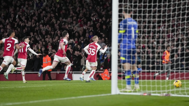 Arsenal's Oleksandr Zinchenko, center, celebrates scoring his side's 3rd goal during the English Premier League soccer match between Arsenal and Burnley at Emirates stadium in London, England, Saturday, Nov. 11, 2023. (AP Photo/Kin Cheung)